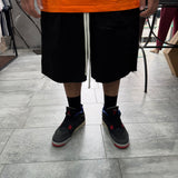 PANTALONCINO OVER-SIZE IN COTONE RIGIDO TAGLIO VIVO